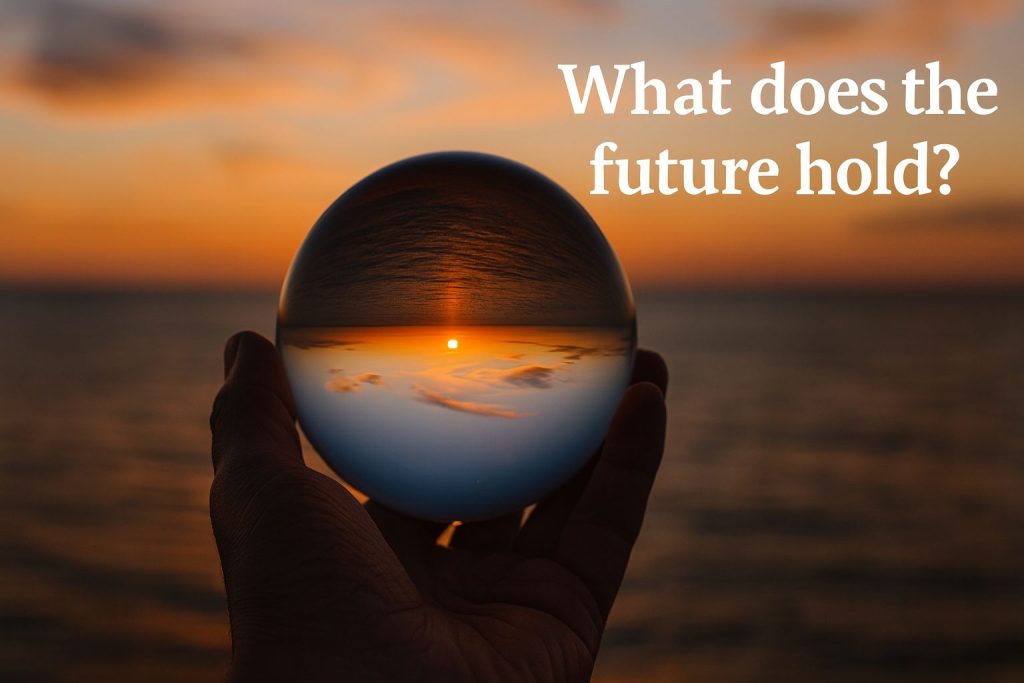 A hand holds a crystal ball reflecting a sunset over the ocean, with the text "What does the future hold?" in the background.