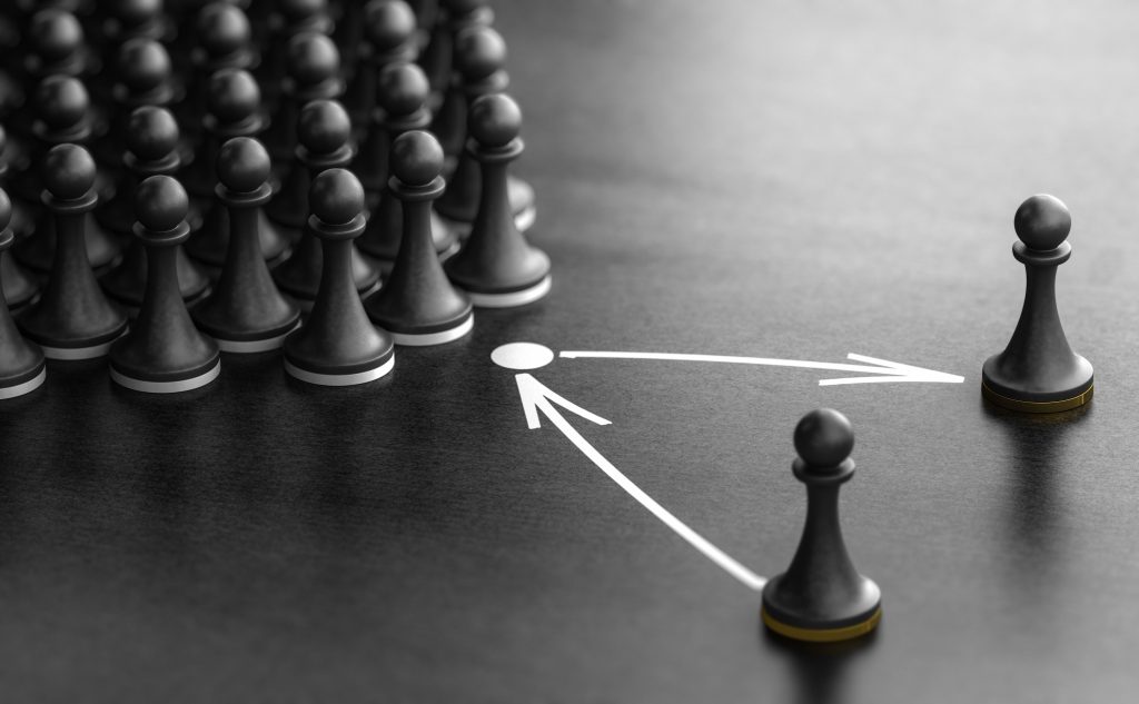 Black chess pawns arranged with arrows pointing to one pawn, symbolizing talent management.