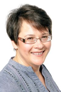 Smiling woman with short hair and glasses, Elna Esterhuizen, Registered Industrial Psychologist in Centurion.