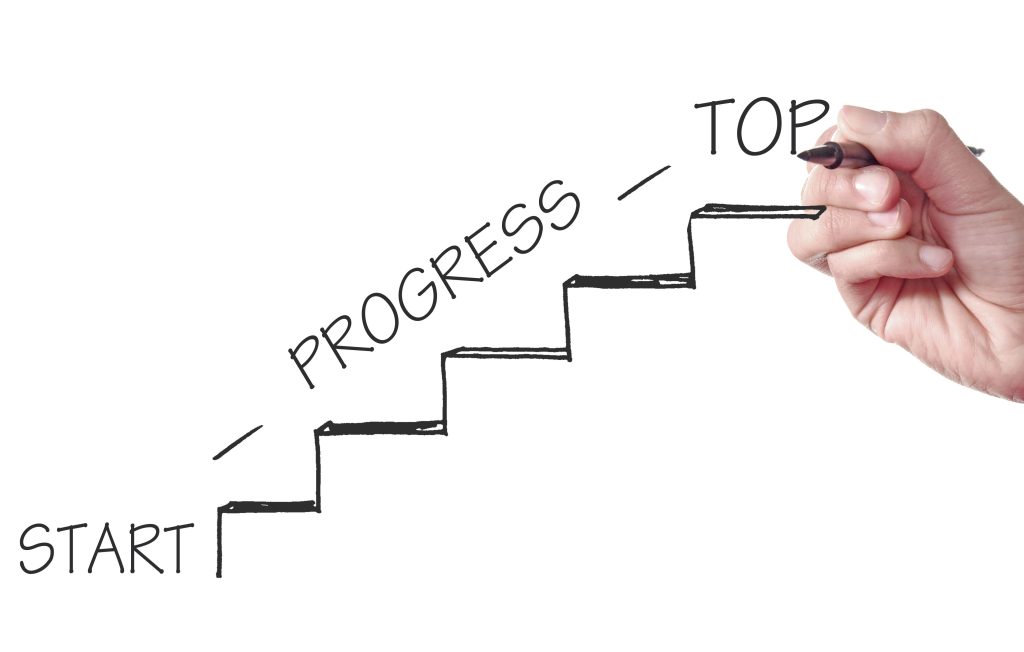 Hand drawing stairs labeled Start, Progress, Top, illustrating career coaching vs career counselling pathways.