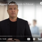 Thumbnail of a man presenting on future trends in education, with blurred classroom background. Rethinking education focus.