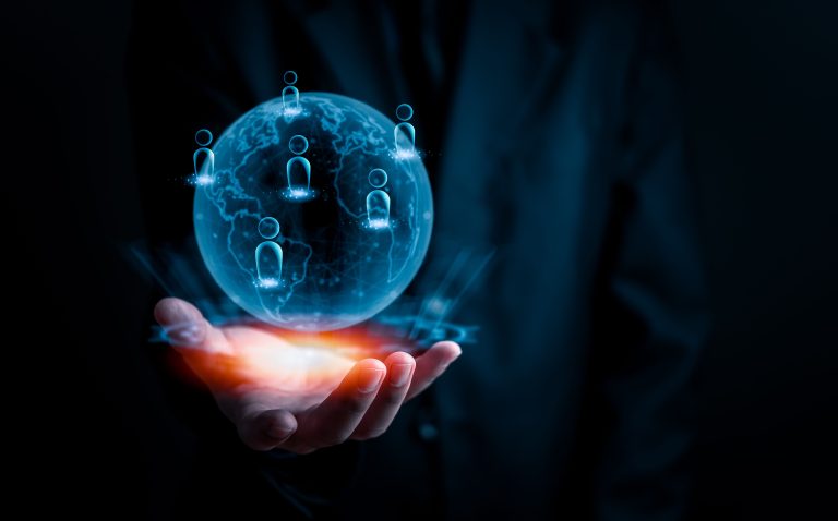 Hand holding a glowing globe with network icons, symbolizing global HR consulting services.