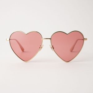 Heart-shaped sunglasses with pink lenses symbolizing Enneagram Lens type 2, emphasizing empathy and love.