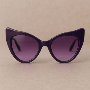 Purple cat-eye sunglasses depicting Enneagram Lens type 4 style on a beige background.