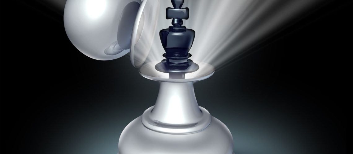 Chess pieces with a spotlight symbolise succession planning strategies and effective leadership transition.
