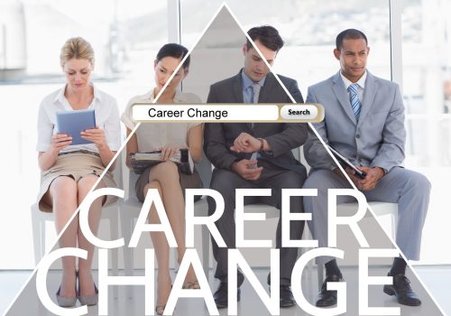 Four professionals seated, searching "Career Change," symbolizing career coaching guidance.
